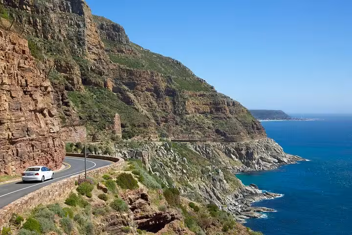 Scenic drive along Chapman's Peak with stunning ocean views on a private tour to Cape Point, Cape Town.