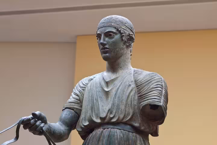 Discover the iconic Charioteer of Delphi statue in the Archaeological Museum, a highlight of the private Delphi tour.