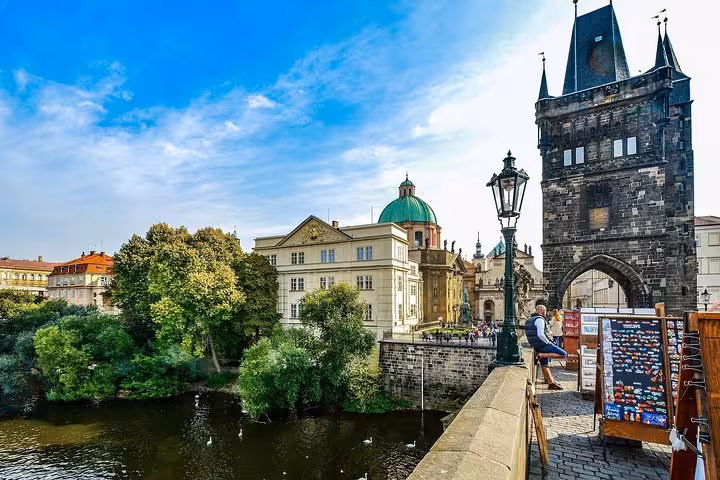 Charles Bridge tower and Vltava River view in Prague, must-see on a private day trip from Vienna