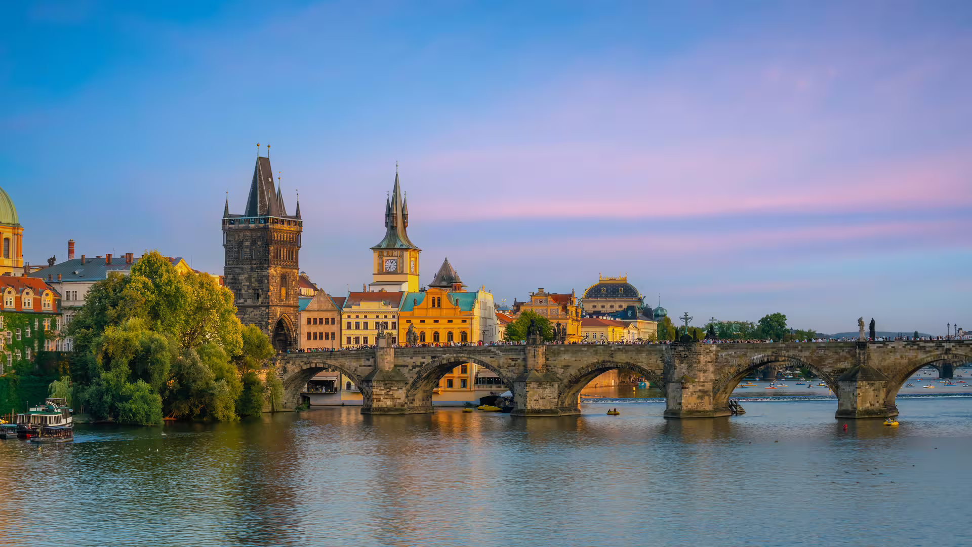 Charles Bridge over the Vltava River at sunset, highlight of Prague in 1 day walking tour audioguide