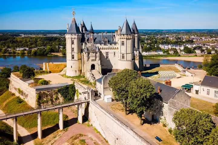 Aerial view of Château de Saumur with Loire River and town in background, France