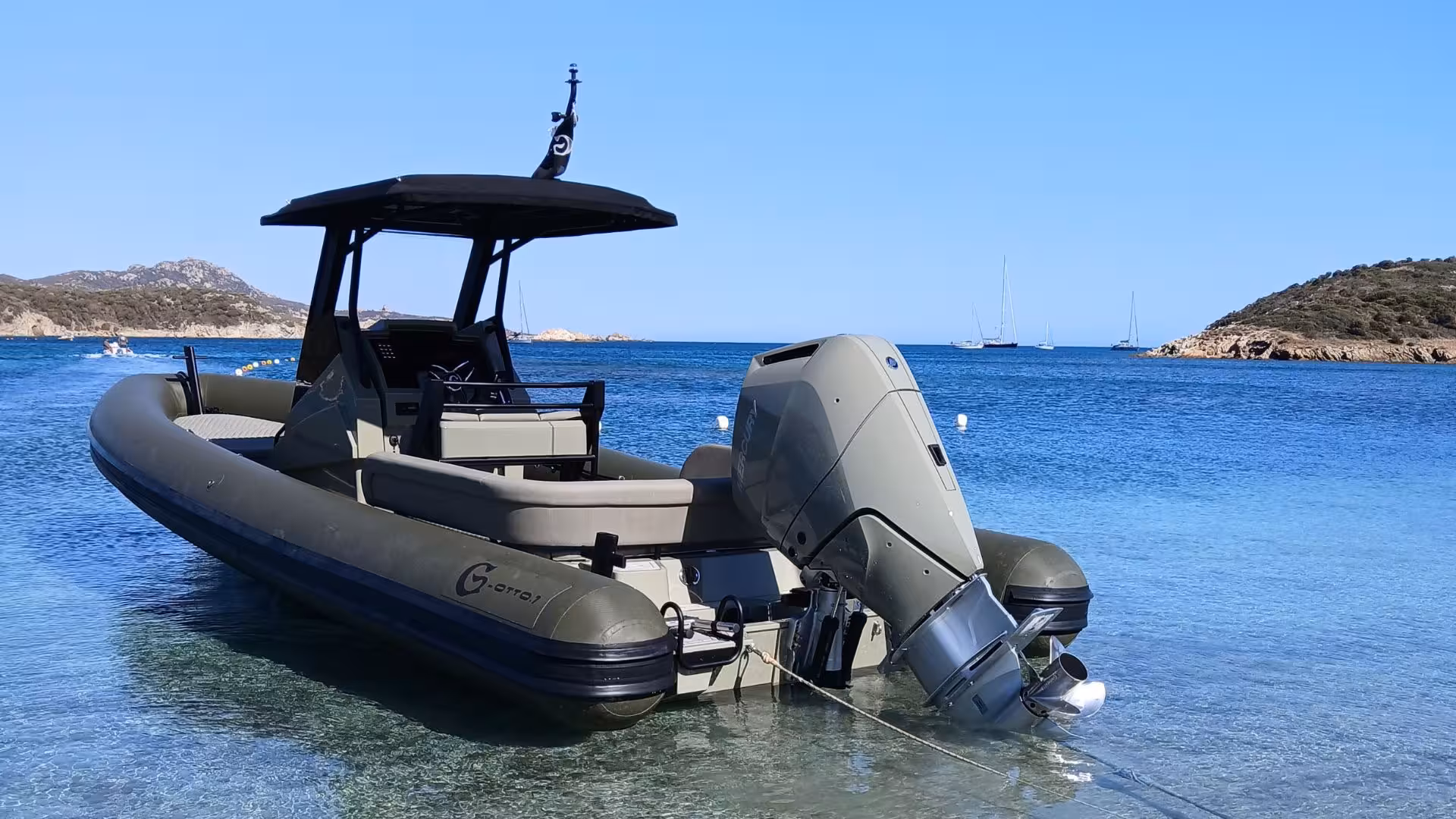 Modern dinghy anchored in Chia's turquoise waters, perfect for an adventurous 4-hour coastal tour experience.
