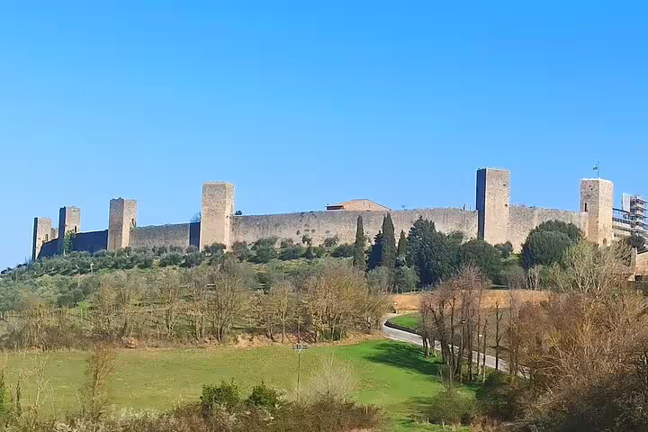 Medieval hilltop fortress in Chianti Classico countryside visited on Black Rooster and Super Tuscan wine tasting tour in Tuscany