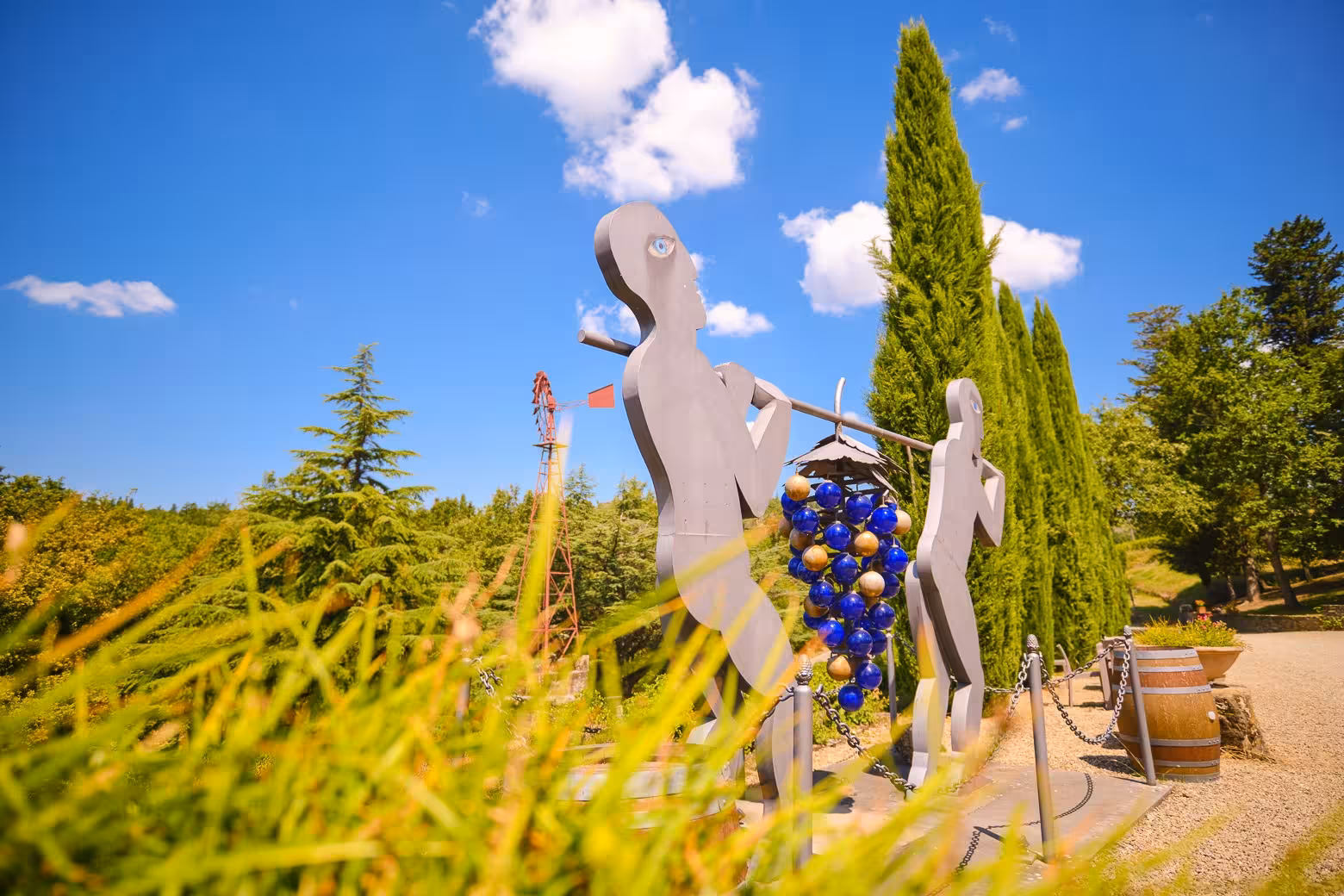 Artistic vineyard sculpture under blue skies, highlighting Chianti wine region's charm on a Florence tour.