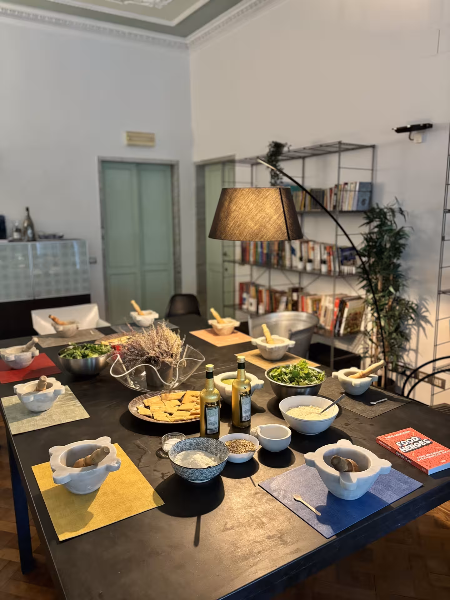 A beautifully set table with Italian ingredients ready for a cooking class on the Chiavari food tour.