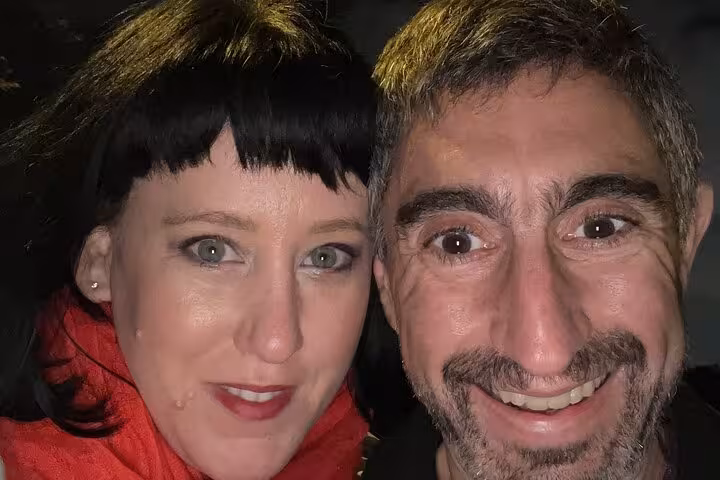 Two smiling adults on Chicago Lincoln Park ghost walking tour at night