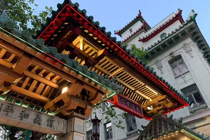 Ornate red and gold pagoda gate entrance to San Francisco Chinatown with traditional Chinese architecture