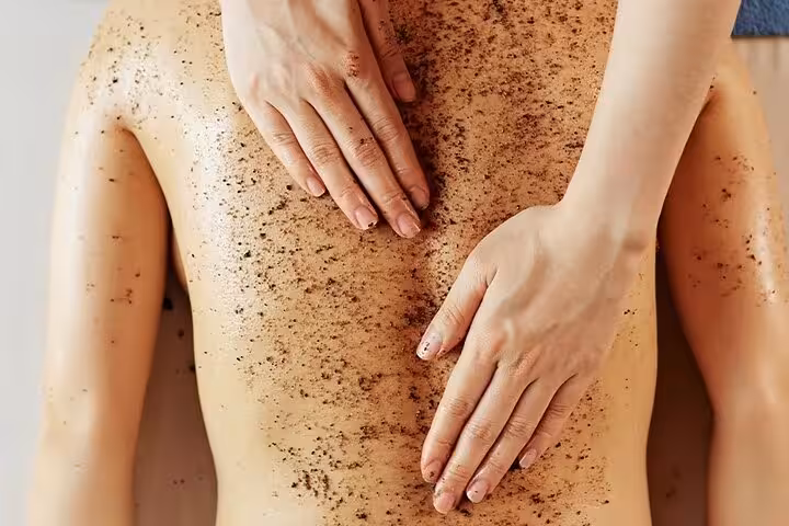 Chocolate body scrub exfoliation on back during Chocolate Magic Bath Spa Experience in Sharm El Sheikh
