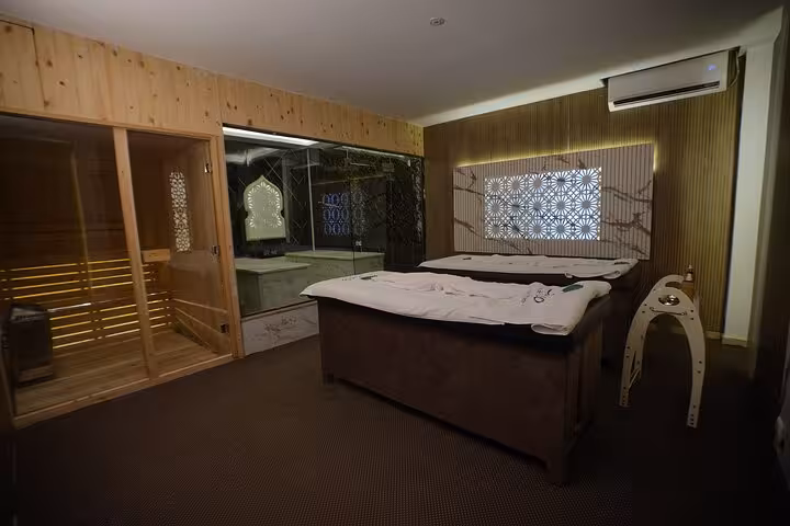 Luxury Sharm El Sheikh spa suite with massage table and sauna, part of Chocolate Magic Bath Spa Experience