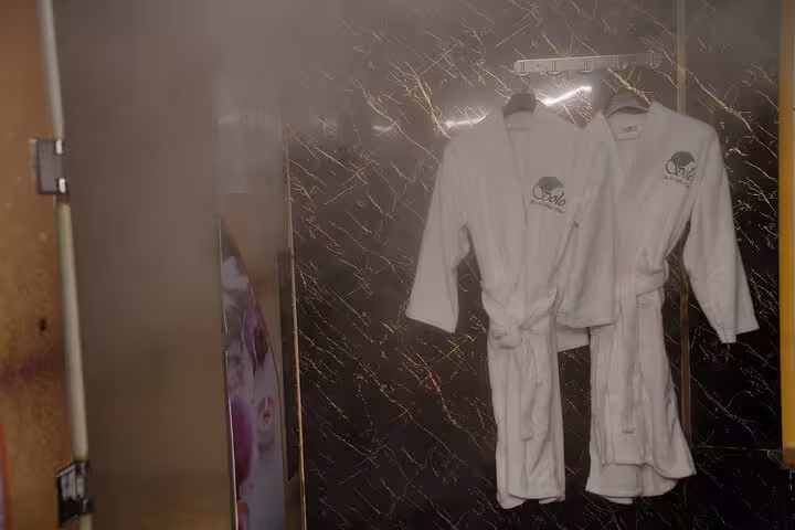 White spa bathrobes ready for guests at Sharm El Sheikh chocolate spa bath experience and relaxation package