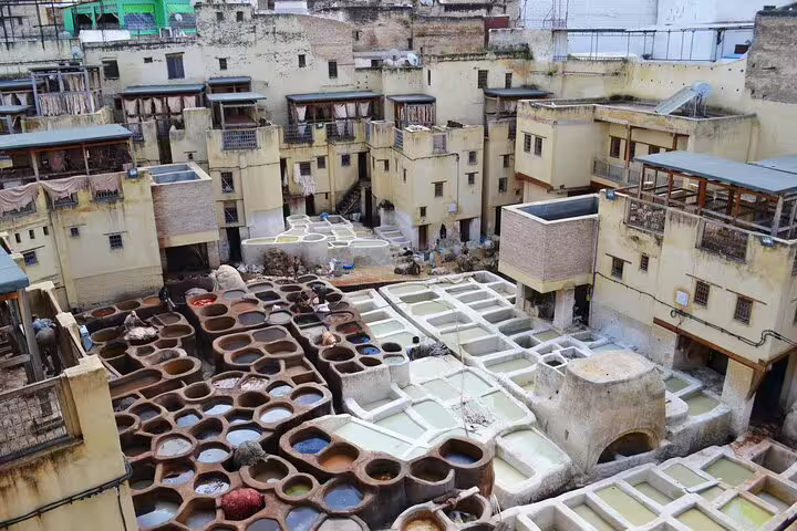View of Chouara Tannery dye vats in Fes medina on Your Own Morocco walking tour, artisan leather heritage