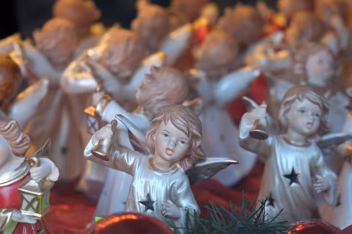 Close-up of angel figurines at a Christmas market stall on a small-group Christmas Day trip from Vienna to Hallstatt