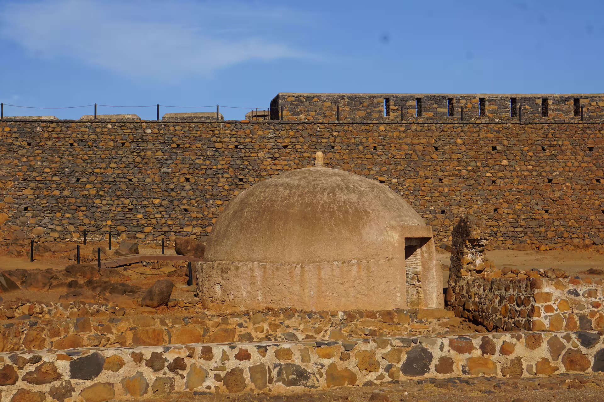 Ancient stone structure and walls basking under the sun in Cidade Velha, Cape Verde.