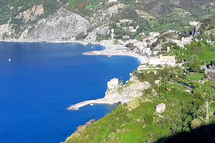 Panoramic view of the rugged Ligurian coastline and turquoise sea near Cinque Terre, seen on a private Porto Venere day tour