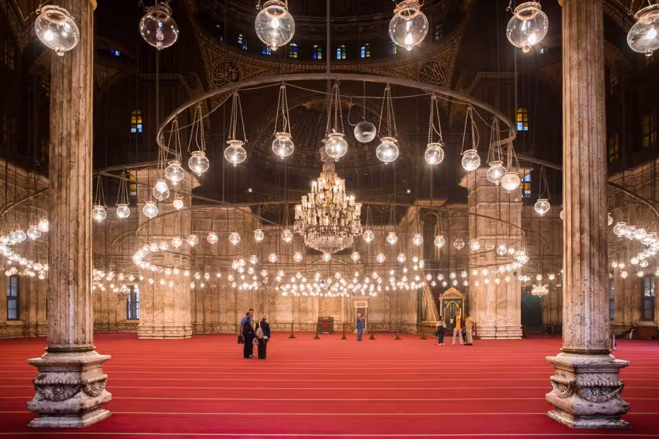 Citadel of Saladin mosque interior in Old Cairo with chandeliers and red carpet on private Cairo tour
