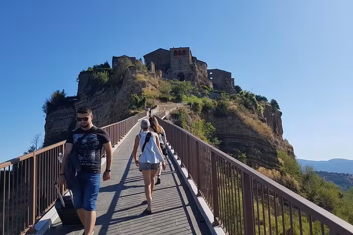 Walkway to Civita di Bagnoregio cliff village on 8-day private Tuscan medieval villages tour Italy