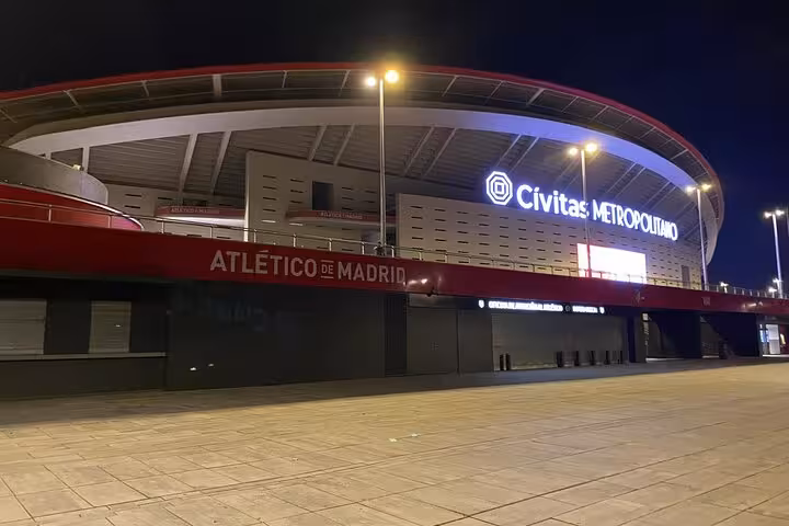 Civitas Metropolitano stadium exterior at night, meeting point for Atletico Madrid game experience with local