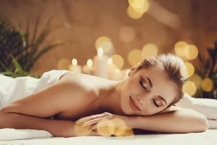 Relaxing full-body massage at Hurghada Cleopatra Deluxe Spa, soothing candles, sauna and jacuzzi access