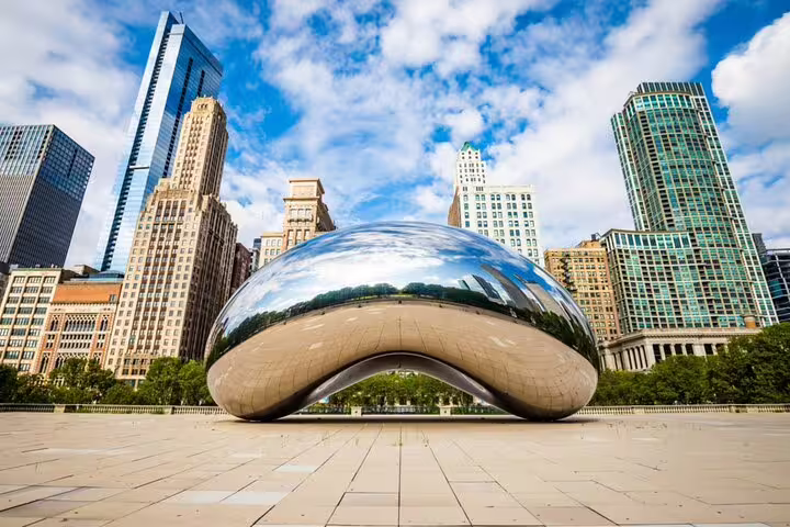 Cloud Gate sculpture reflecting Chicago skyline in Millennium Park, Grant Park