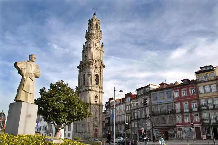 Clérigos Tower and historic architecture in Porto, Portugal on a sunny day, featured in private tour from Lisbon.
