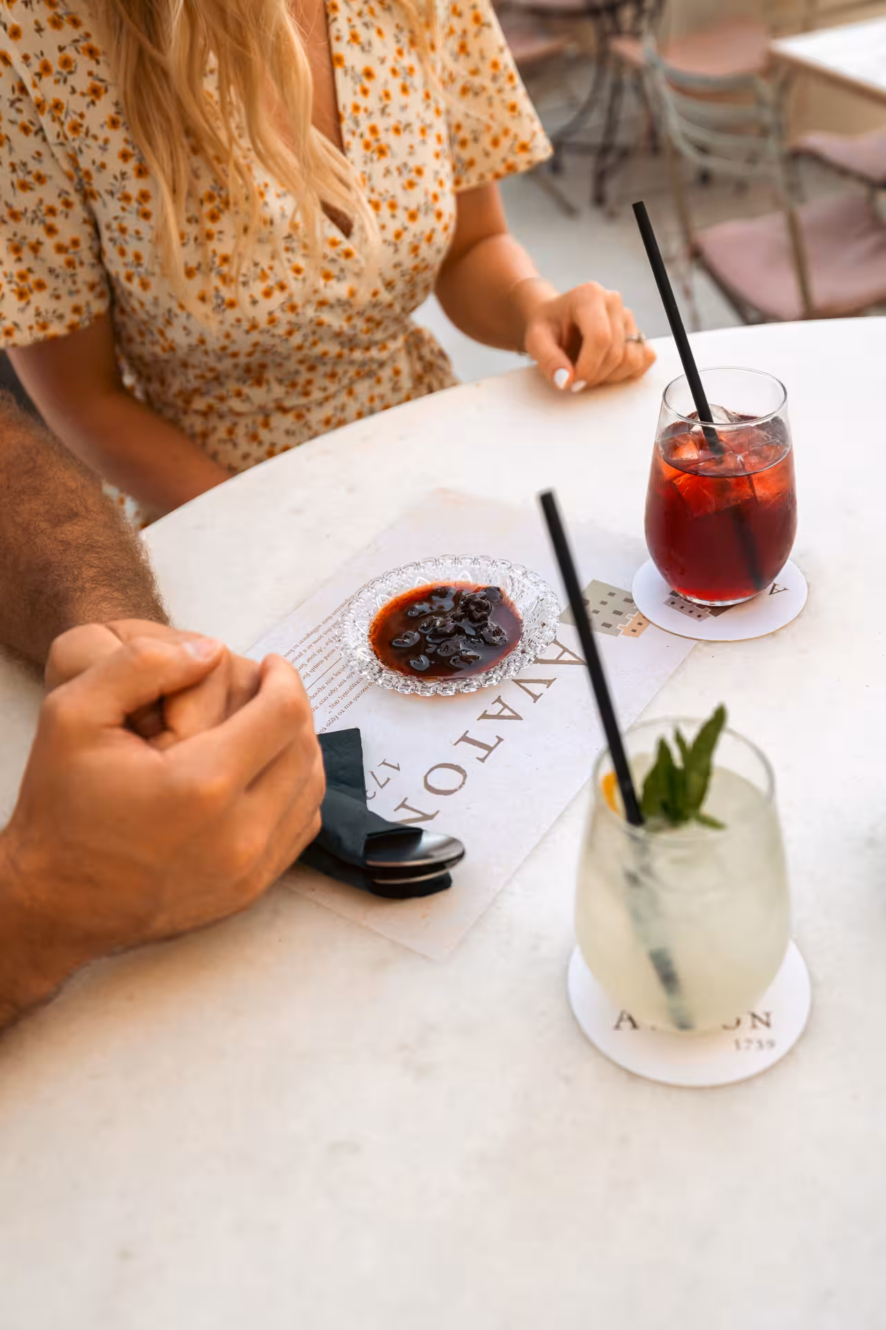 Cocktails and local Naxos meze on a café table during the Munch Around Naxos Town food tour in Greece