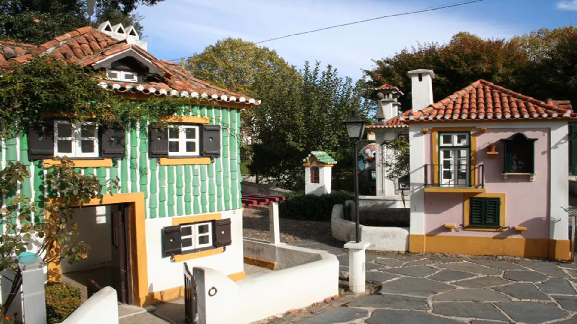Charming miniature houses at Portugal dos Pequenitos, a stop on the private tour to University of Coimbra and ancient Roman city.