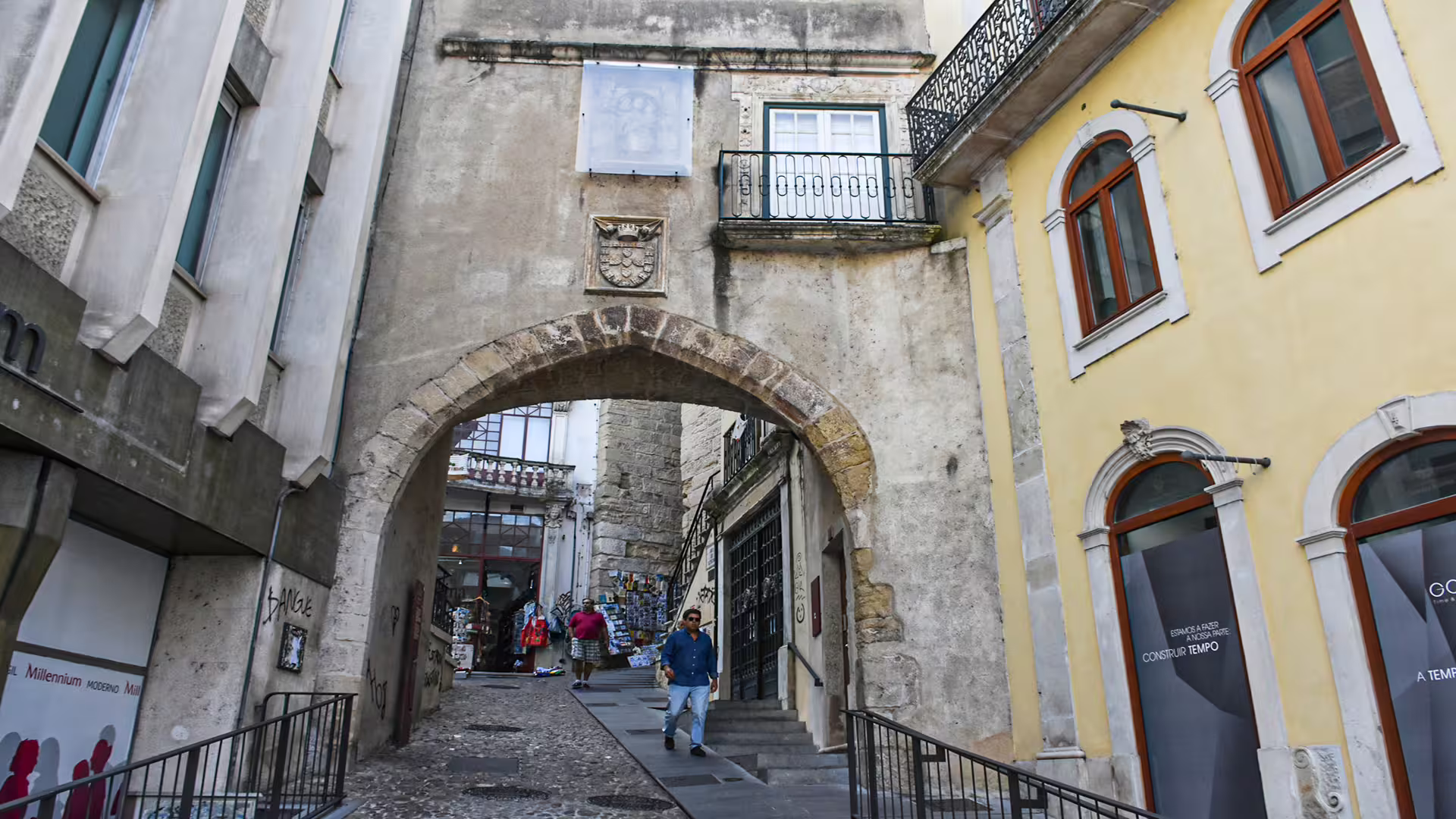Historic archway entrance in Coimbra's old town, offering a glimpse into the rich heritage of this iconic university city.