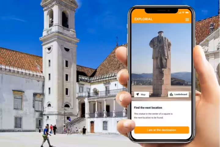 Self-guided Coimbra scavenger hunt app on phone with landmark square and historic university buildings