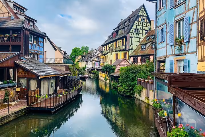 Colorful half-timbered houses lining a canal in Colmar, Alsace, France