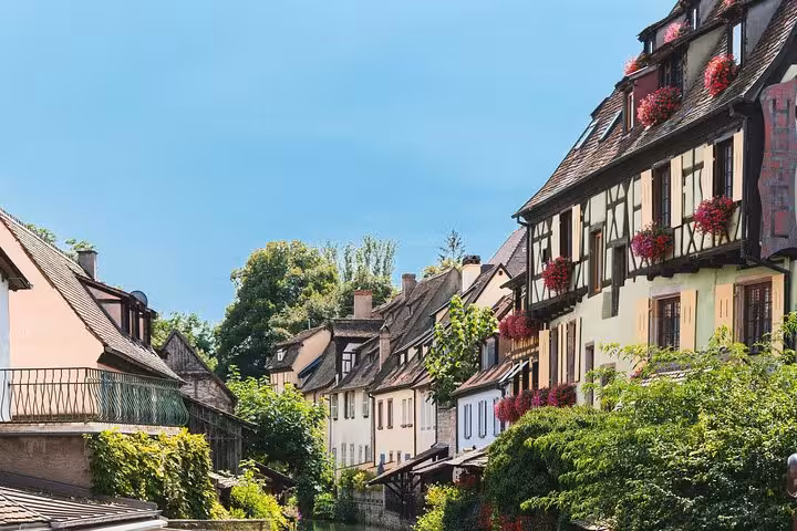 Colorful half-timbered houses with flower boxes along a canal in Colmar, Alsace, France