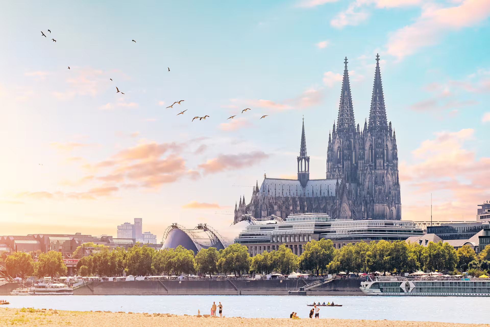 Cologne Cathedral skyline over the Rhine at sunset, highlight stop on a 1-day walking audioguide tour