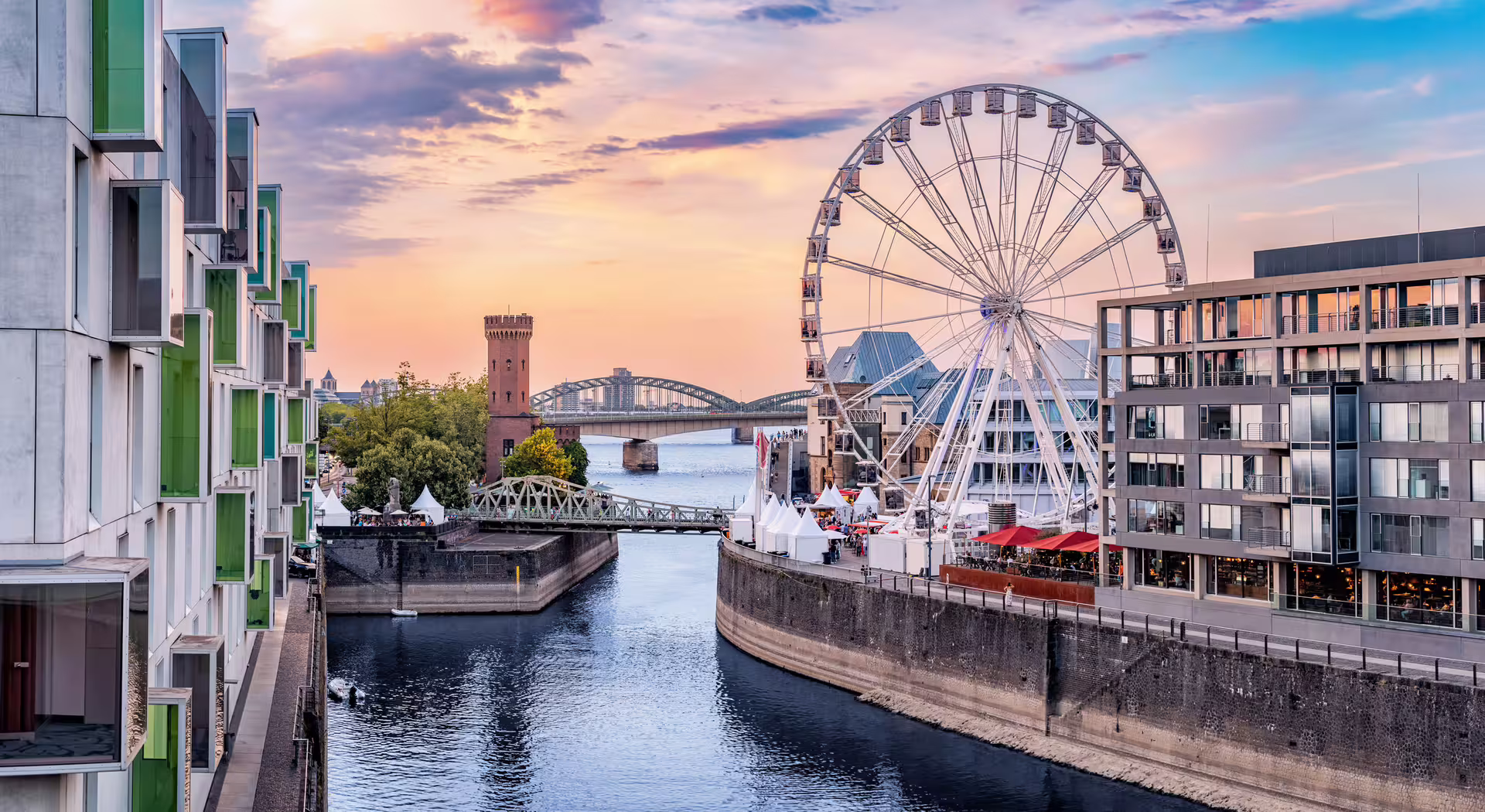 Cologne Rheinauhafen with giant Ferris wheel and waterfront promenade, 1-day walking tour audioguide stop