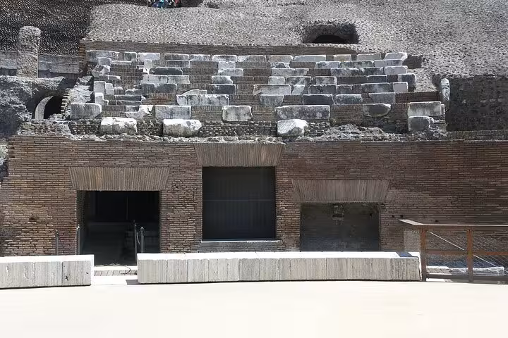 Close-up of the Colosseum's ancient stone seating, highlighting the architectural details of this iconic Roman landmark.