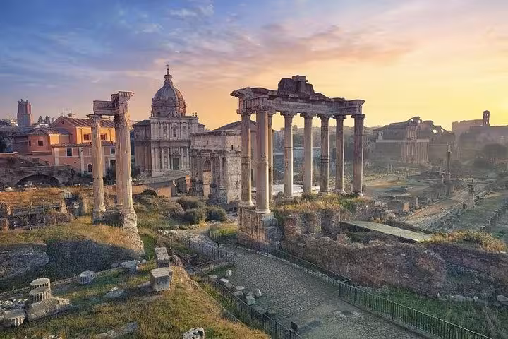 Explore the ancient Roman Forum ruins at sunset on the Arena Floor Access Experience tour in Rome.