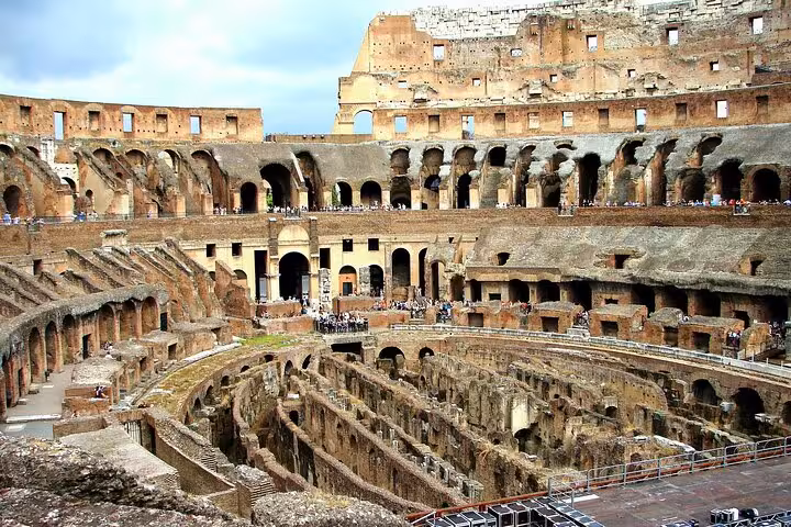 Panoramic view of the Colosseum arena and stands, highlighting the grandeur of ancient Rome on a guided tour.