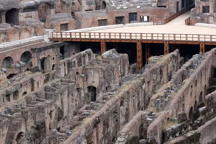 View of the underground hypogeum and reconstructed arena floor on an exclusive Colosseum gladiators tour in Rome