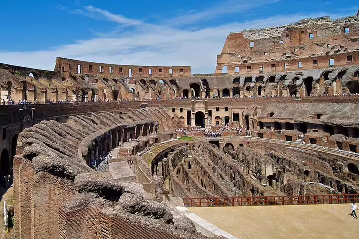 Interior of the Colosseum in Rome with ancient arena and crowds, included in 3 day private guided tours with transfers
