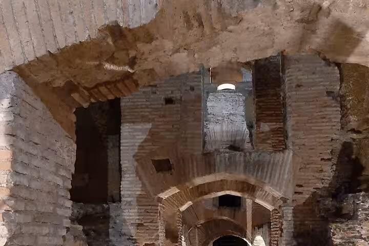 Explore the ancient underground passages of the Colosseum on a captivating Rome night tour.