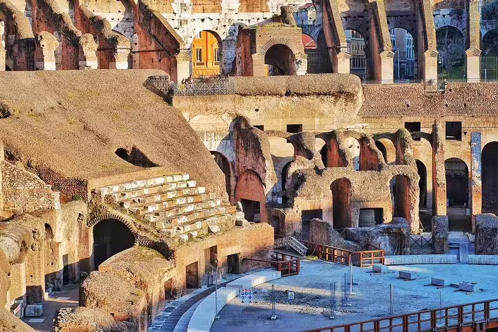 Close-up of the Colosseum’s underground chambers and crumbling arches viewed on a Roman Forum and Palatine Hill guided tour