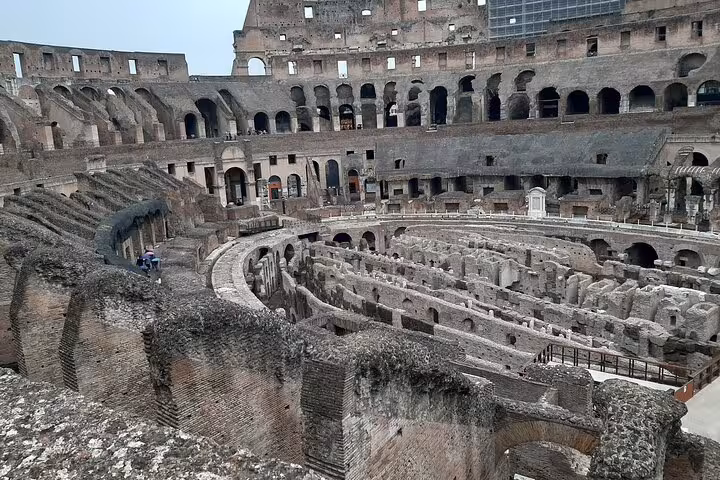 Discover the Colosseum's historic underground passages and arena floor on an exclusive guided tour in Rome.