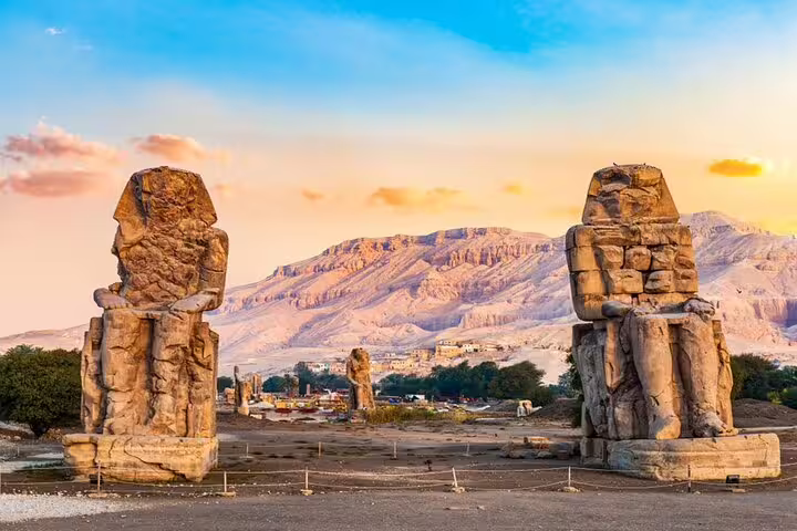 Colossi of Memnon statues at sunrise in Luxor, highlight stop on Luxor day tour from Safaga Port