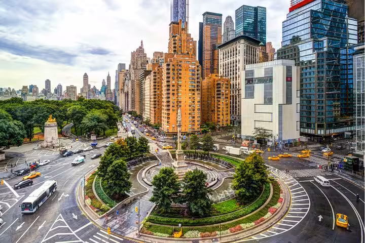 Aerial view of Columbus Circle roundabout with fountain, skyscrapers, and Central Park in Manhattan, NYC