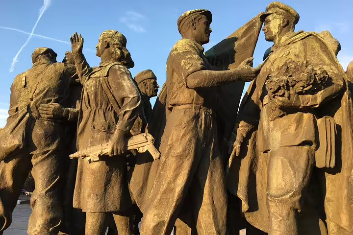 Golden bronze statues of Soviet-era soldiers and workers, part of a Communist monument in Sofia, Bulgaria
