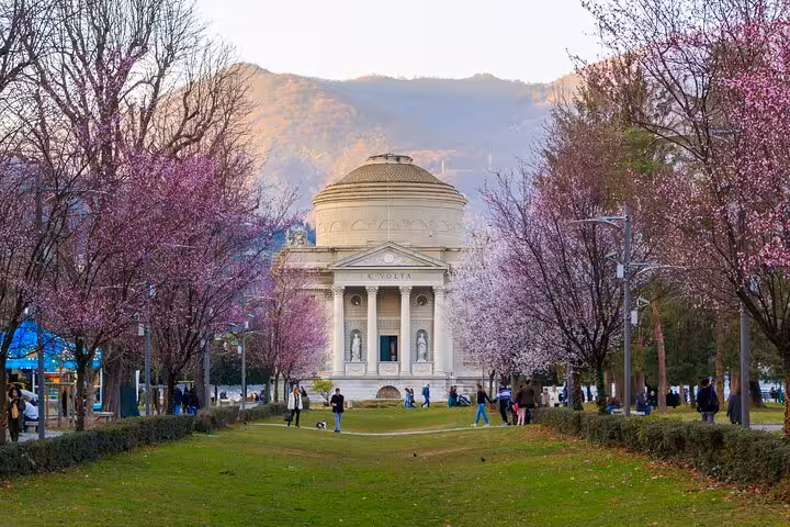 Spring view of Como’s Tempio Voltiano near the lakefront, a scenic stop on a guided city boat tour