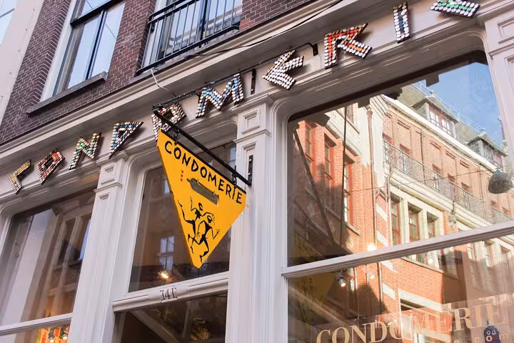 Condomerie shopfront in Amsterdam De Wallen, popular stop on a private Red Light District tour and nightlife walk