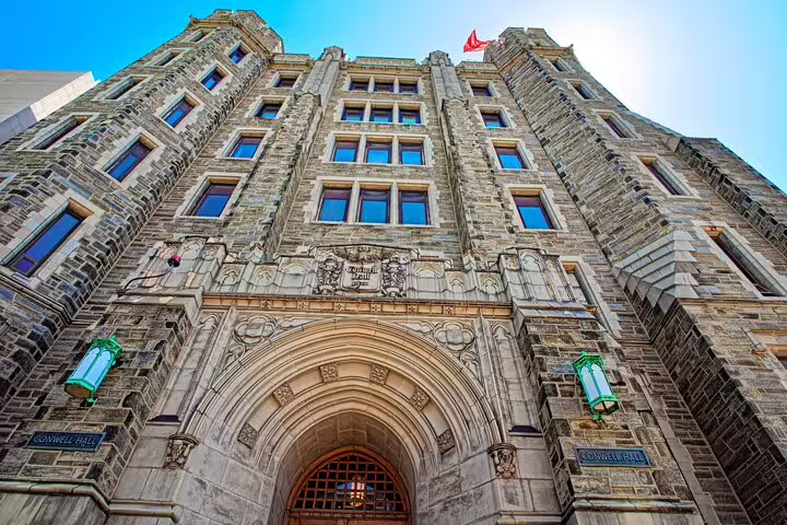 Conwell Hall gothic stone building façade with arched entrance and green lanterns in Philadelphia