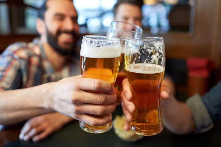 Cheers with friends enjoying craft beers on the Copenhagen Food & Drink Private Tour, exploring Scandinavian delights.