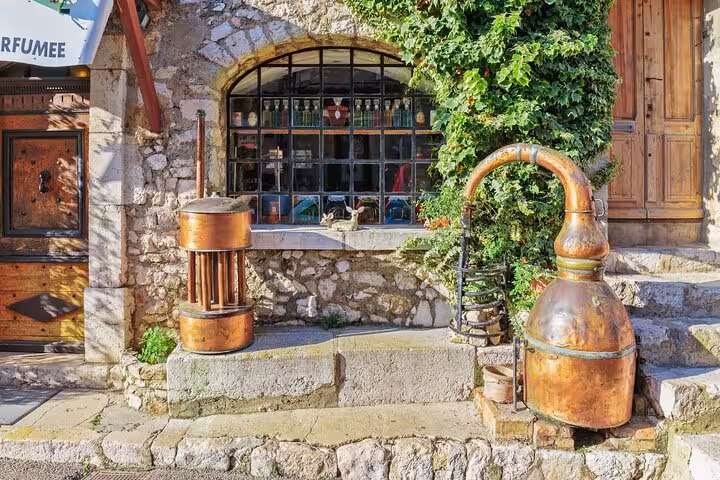 Antique copper distillery alembic outside a perfume shop in Grasse, French Riviera