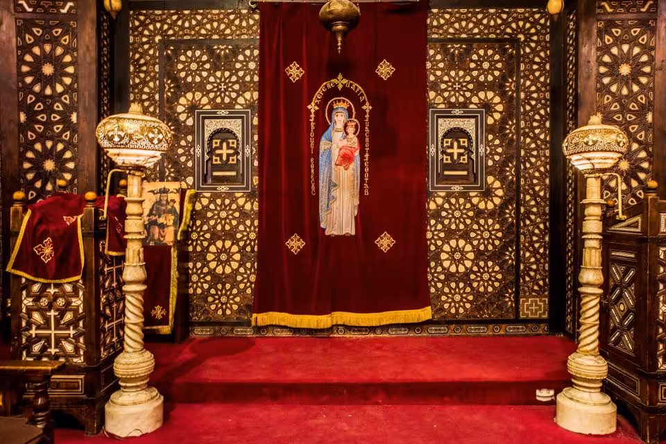 Coptic Cairo church altar with ornate woodwork and icon curtain, featured on Islamic and Coptic tour
