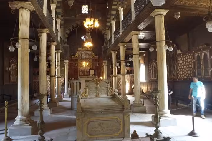 Historic Coptic Cairo church interior with marble columns and ornate altar on a 2-day Cairo tour